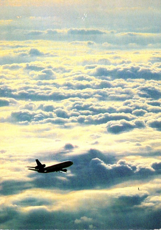 Lufthansa Flying Over The Clouds