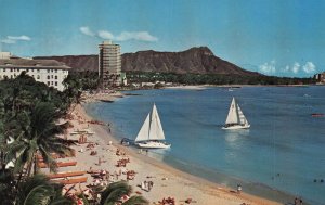 VINTAGE POSTCARD WAIKIKI BEACH WITH ALL THE USUAL ACTIVITIES THAT MAKE IT FAMOUS