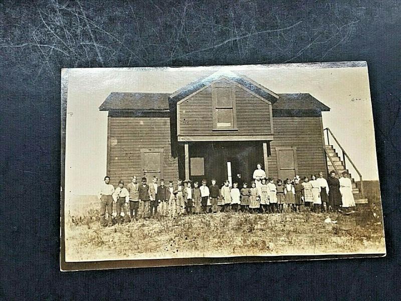 Postcard  RPPC Class, Teacher and Old School House.    U6