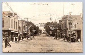 J90/ Hartford Wisconsin RPPC Postcard c1910 Madison St Stores Patriotic 254