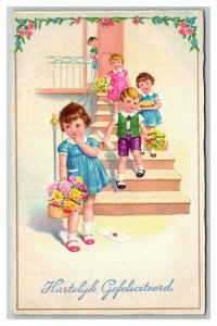 Vintage 1935 Postcard Cute Dutch Children Carry Baskets of Colorful Flowers