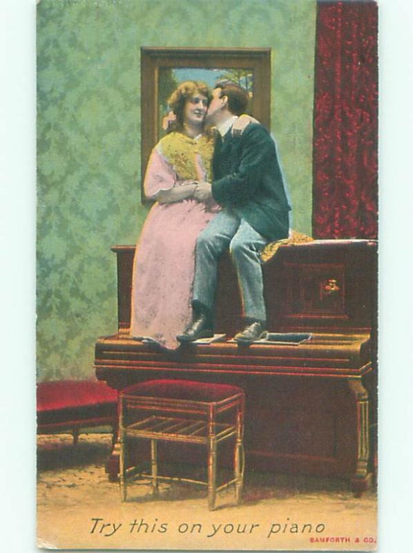 Pre-Linen ROMANTIC COUPLE SITTING ON ANTIQUE PIANO AB7521