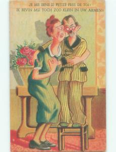 foreign Old Postcard SHORT MAN STANDING ON CHAIR BESIDE TALL WOMAN AC2608