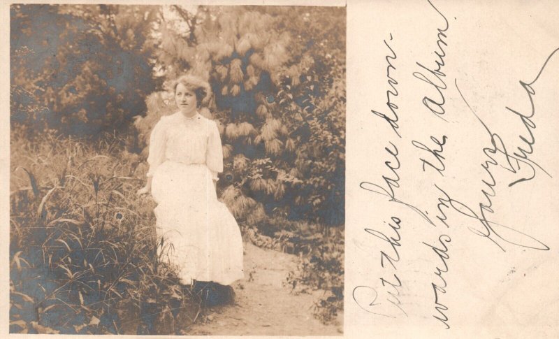 1907 Woman in White Dress Sitting Among Flowers Real Photo RPPC Vintage Postcard