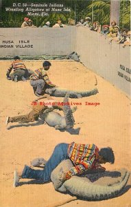 Native American Seminole Indians, Wrestling Alligators at Musa Isle, Miami FL