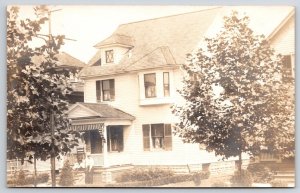 Man & Daughters Sitting on Front Porch Home Street View Real Photo RPPC Postcard