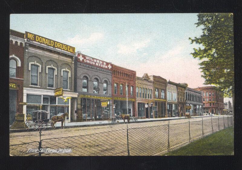 FARGO NORTH DAKOTA DOWNTOWN FRONT STREET SCENE VINTAGE POSTCARD DRUG STORE