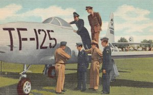 U.S.A.F. Preflight Students Looking at an F-80 Jet Fighter, early linen postcard