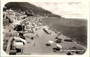 c1920 ALASSIO SPIGGIA ITALY BEACHSIDE TENTS HOMES BOATS RPPC POSTCARD 42-345