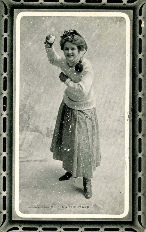 Hitting the Mark. Woman throwing snowball