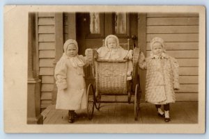 c1910's Little Girls Baby On Wicker Stroller House Porch RPPC Photo  Postcard