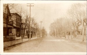 RPPC Street Scene Houses Men Trench Coats Horse Drawn Wagons Postcard Z24