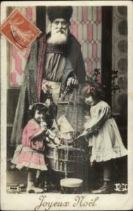 French Christmas - Cleric Santa Claus & Kids Tinted Real Photo Postcard c1910