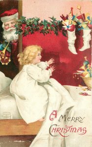 Clapsaddle Christmas Art Postcard Santa Watches as Child Finds Toys in Stocking