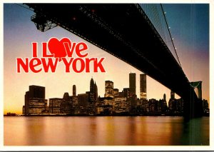 New York Brooklyn Bridge At Night and Lower Manhattan Skyline With World Trad...