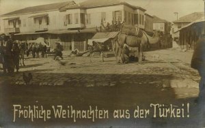 turkey, Unknown Town, Street with Camel, Christmas (1912) RPPC Postcard 
