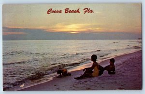 c1976 Cocoa Beach Florida FL Postcard Seaside People Siting Sand Sunset Posted