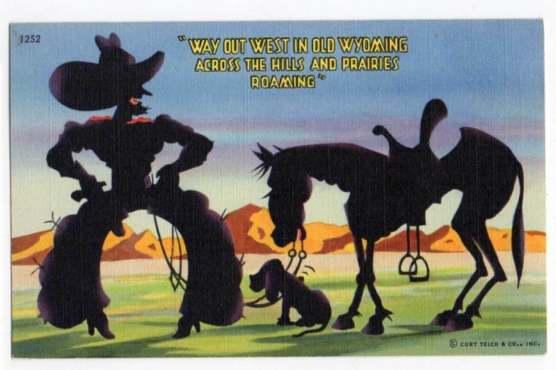 030721 VINTAGE WYOMING LINEN POSTCARD COWBOY AND HORSE SILHOUETTE