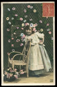 Sazerac studio RPPC of little girl & flowers. Mailed 1907 to Libreville, Gabon