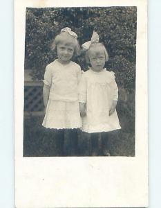 1916 rppc TWO GIRLS WITH BOWS IN THEIR HAIR - PROBABLY SISTERS HM0456