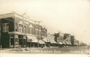 RPPC Postcard Main Street Looking East Geneva NE Fillmore County Brown Garage NE