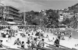 Acapulco Mexico~Playa De Caleta~Beach Scene~Sunbathers~Hotels?~Ship Mast~RPPC