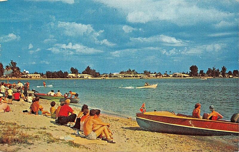 FLORIDA COAST FUN BY THE WATER~WOOD BOAT~CONFEDERTE FLAG ON BOW-1960-POSTCARD