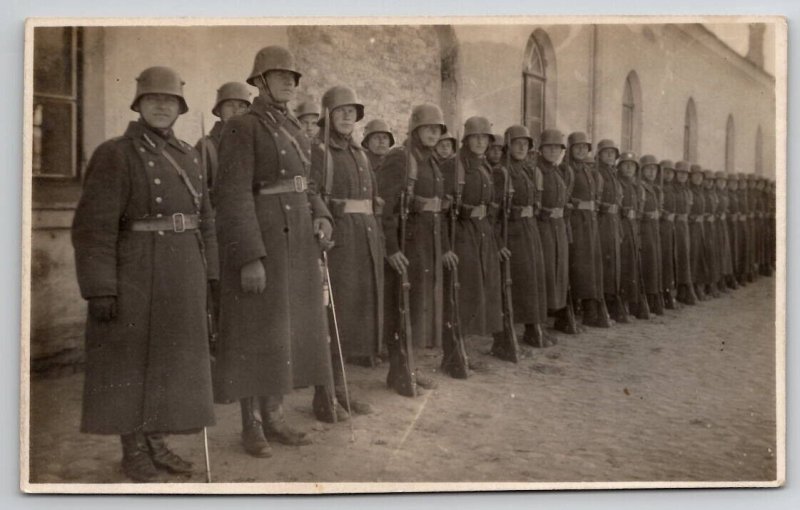 RPPC WW1 Soldiers Long Coats Rifles In Europe Postcard N30