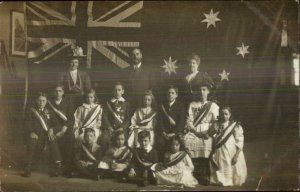 British Group School Kids? Sit in Front of Giant Flag c1910 Real Photo Postcard