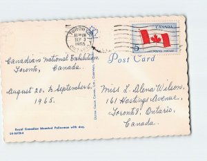 Postcard Royal Canadian Mounted Policeman with dog, Canada