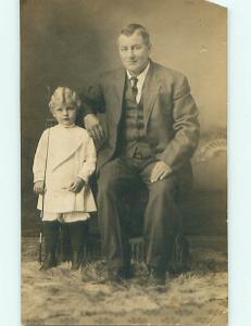 Pre-1929 rppc CHILD WITH BUTTON SHOES HOLDING HORSE WHIP BY DAD r6586