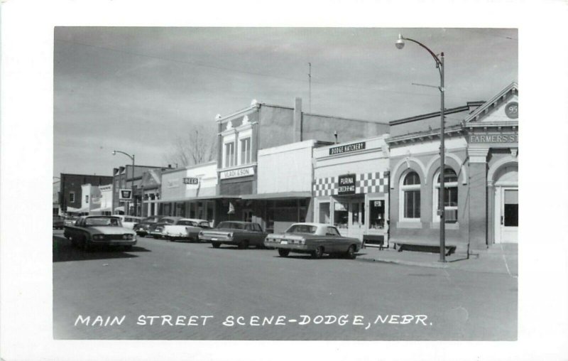 RPPC Postcard Main Street Scene, Dodge NE Cool Cars Businesses Signs