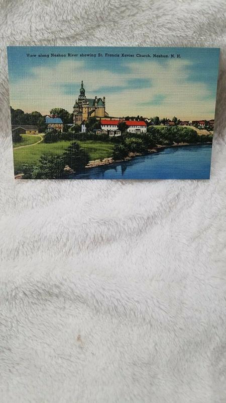 View along Nashua River showing St. Francis Xavier Church, Nashua, NH