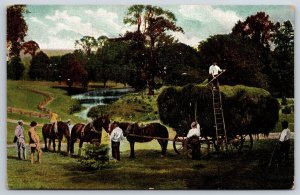 Farming~Hay Harvest Scene W/ Horse Drawn Wagon & Lake In Background~Vtg Postcard