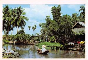 BR99001 thai woman boat vendor selling fruits khlong    thailand