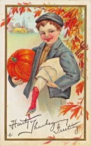 YOUNG BOY CARRYING DEAD TURKEY & PUMPKIN-EMBOSSED HEARTY THANKSGIVING POSTCARD