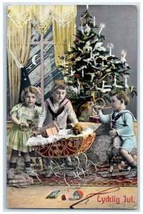 1910 Merry Christmas Children Playing Trumpet Horse Toy Ludington MI Postcard