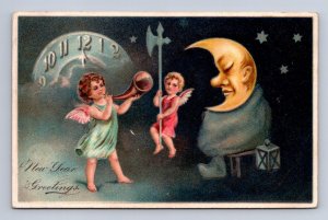 HAPPY NEW YEAR CRESCENT MOON FACE CLOCK ANGEL EMBOSSED PFB POSTCARD 1908