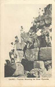 Cairo tourists mounting the Great Pyramids old postcard