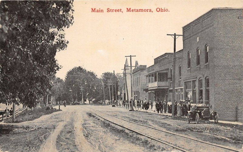 G5/ Metamora Ohio Postcard c1910 Main Street Stores Automobile Crowd 