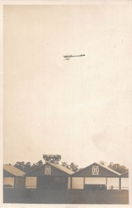 Aircraft Aviation Airplane Flying over 22 & 23 Plane hangars RPPC postcard B