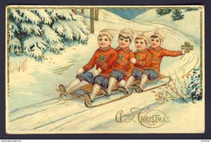 Children sleigh riding, clover, snow - A Merry Christmas - embossed