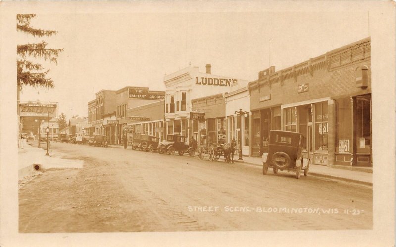 J4/ Bloomington Wisconsin RPPC Postcard c1910 Street Scene Stores Ludden's 109