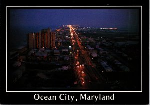 CONTINENTAL SIZE POSTCARD NIGHT VIEW OF OCEAN CITY MARYLAND