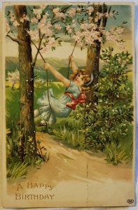 Adorable  Girl On A Tree Swing. C. 1910 Embossed Mountains Blue Dress Red Ribbon