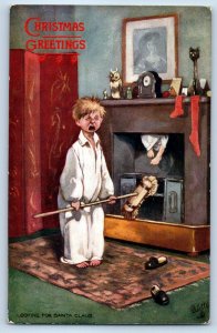 Christmas Greetings Boy Looking For Santa Claus In The Nursery Tuck Postcard