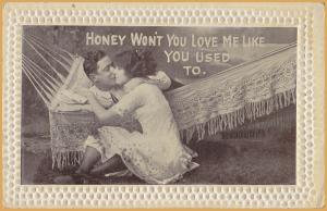Romance-Honey won't you love me like you used to. Lady kissing man in Hammock