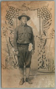 US SOLDIER w/ FLAGS PATRIOTIC STUDIO ANTIQUE REAL PHOTO POSTCARD RPPC