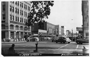 Painesville OH Main Street Storefronts Old Cars Real Photo Postcard