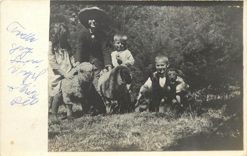 1910 RPPC Postcard; 4 Children & their Pets, 2 Sheep & 2 Puppy Dogs Unknown US